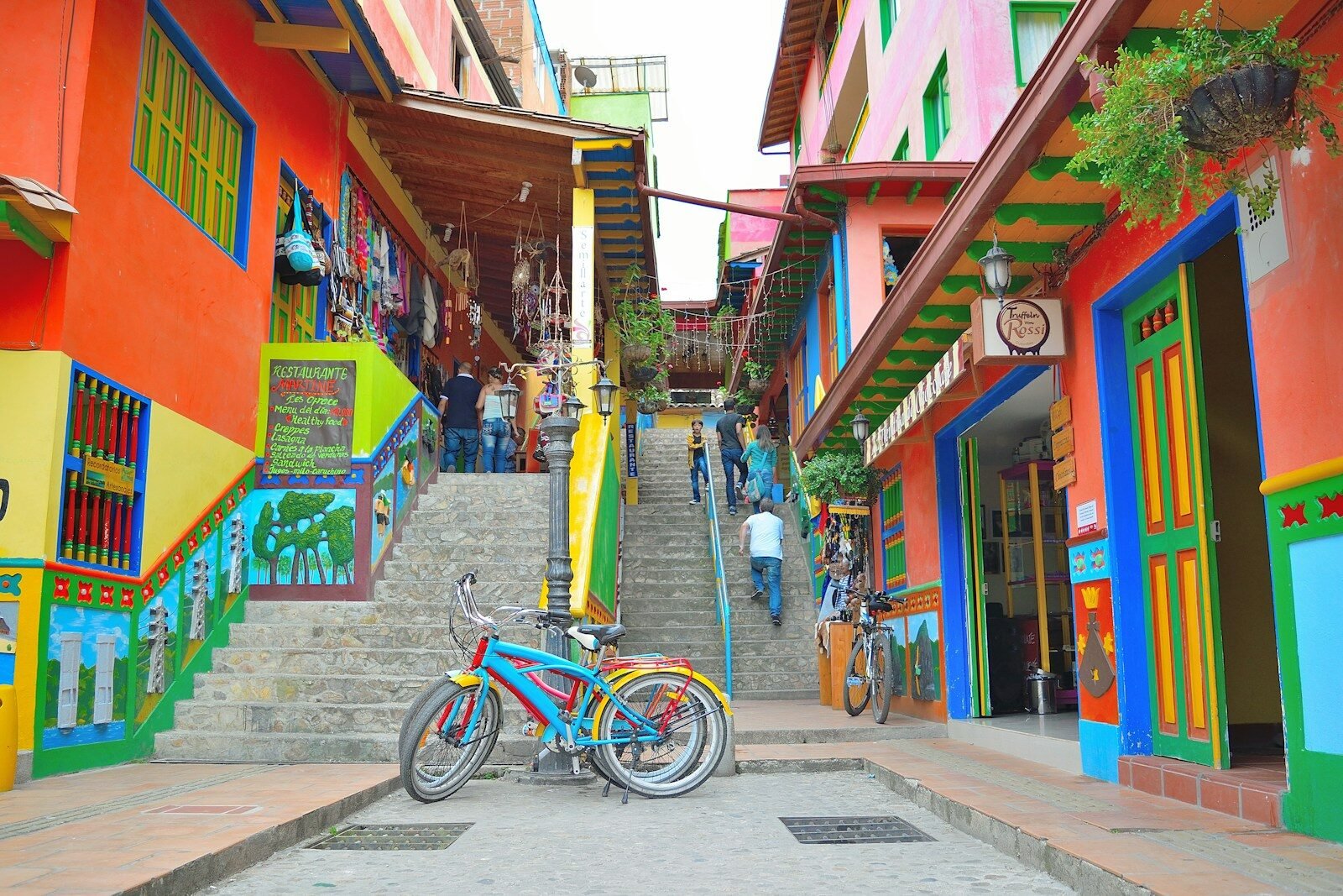 Colorful buildings line a steep staircase in a town