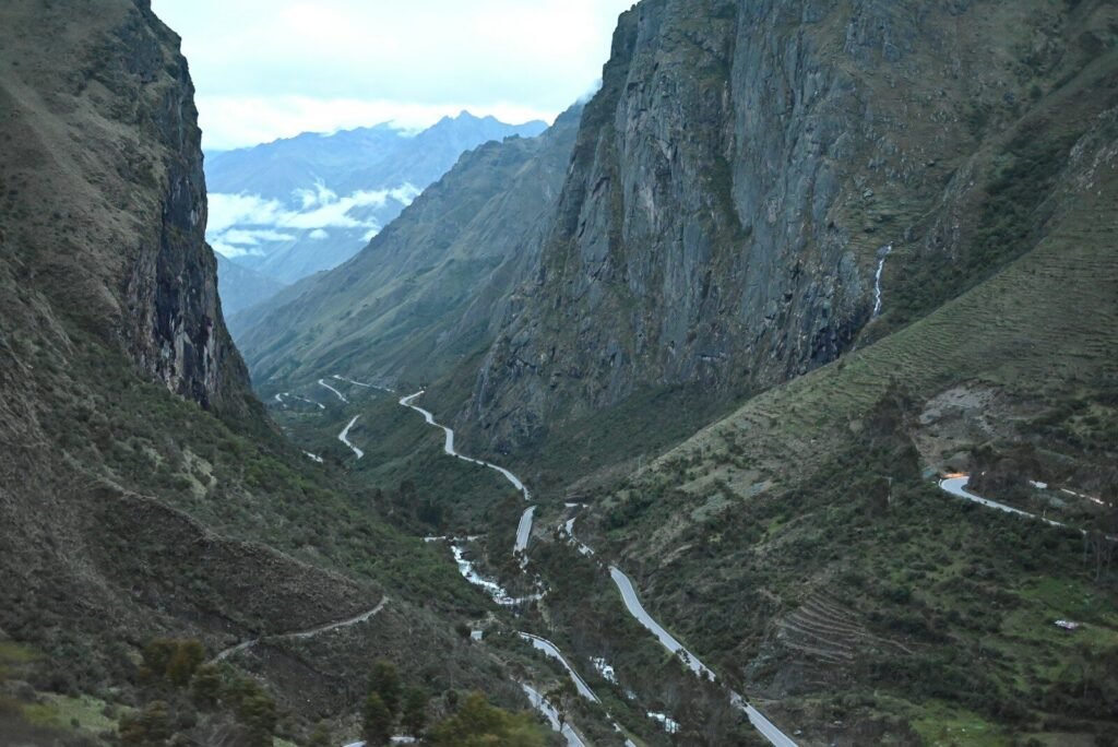 Winding road through a steep mountain valley